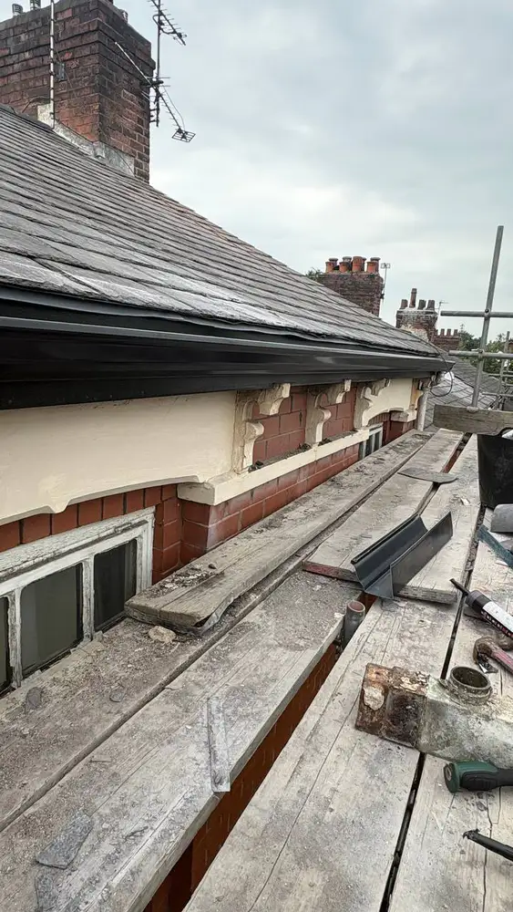 Roofline and gutter repair completed from scaffolding
